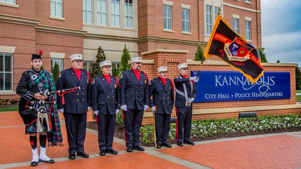 A police and fire honor guard presided over the flag-raising ceremony at the city hall dedication on Monday. Courtesy of City of Kannapolis
