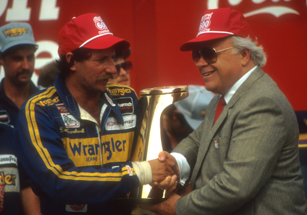 Dale Earnhardt receives congratulations from track owner Bruton Smith after winning the Coca-Cola 600 at the Charlotte Motor Speedway in May 1986. (Photo/LMS Archives)