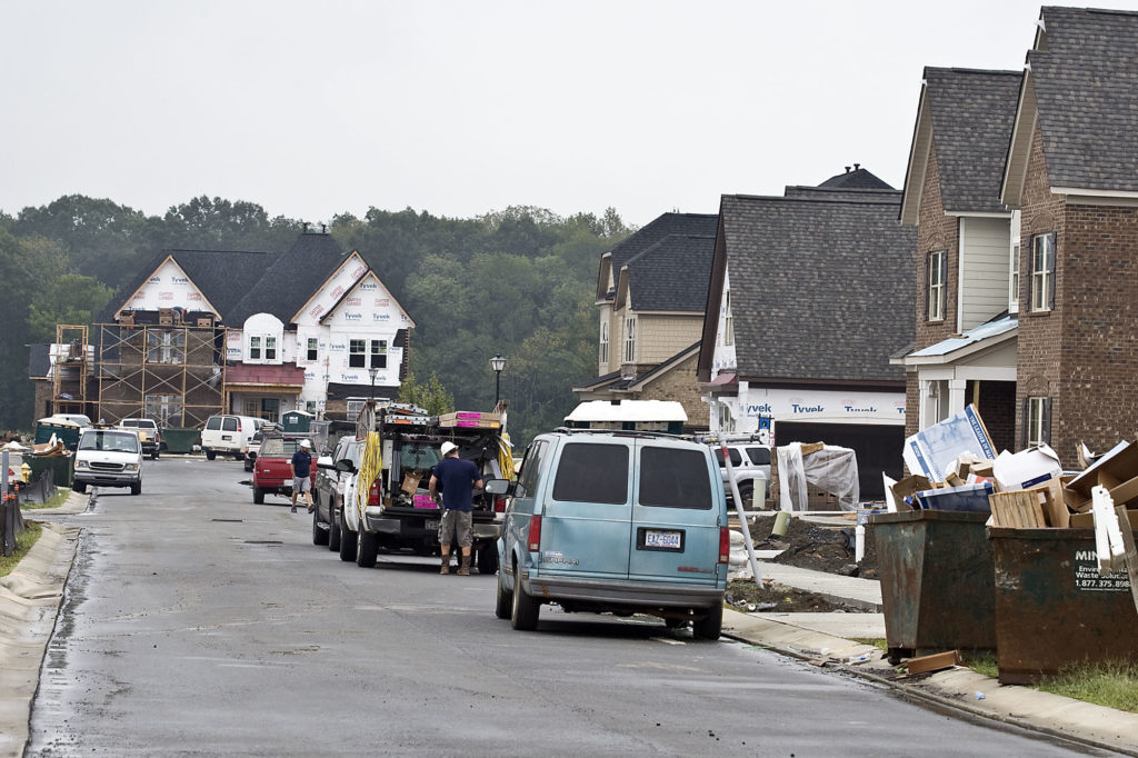Workers line Marigold Place in the Blume subdivision in Harrisburg, NC.  150 homes have been built since construction began in 2013.  With 297 lots planned multiple homes are under construction with lots selling quickly. Photo by Marty Price